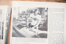 Load image into Gallery viewer, A black and white photo of an old article in which Ted Moores is wearing a Bear Mountain Boats t-shirt
